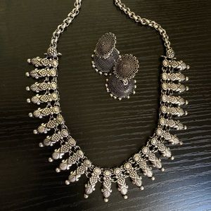 Intricate Silver Necklace and Earring Set